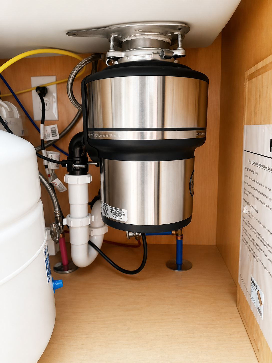 Bear Hug Plumbing garbage disposal installation under kitchen sink in Flagstaff AZ