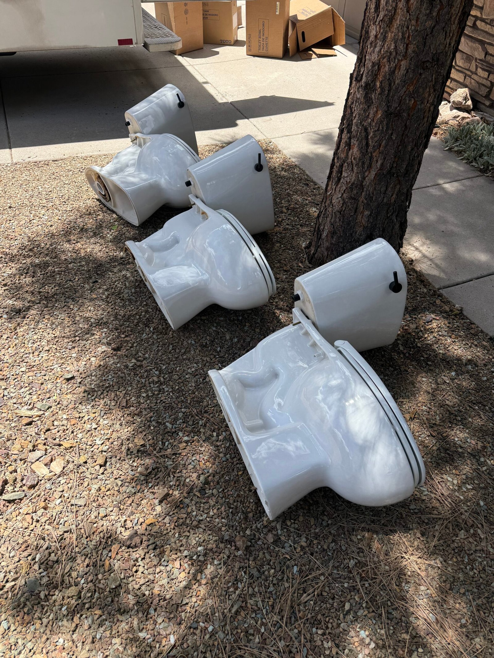 Three old toilets removed during a toilet replacement project in Ponderosa Trails Flagstaff Arizona