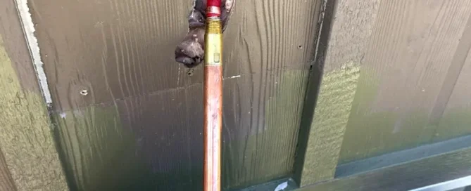 Outdoor hose bib and hose connection installed by Bear Hug Plumbing