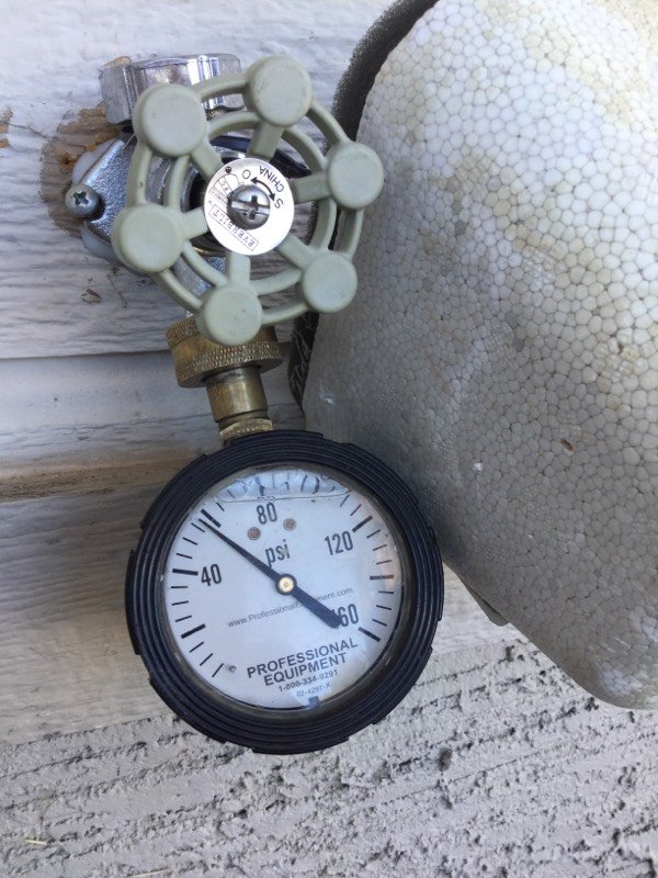 Gas line pressure test gauge during gas line work by Bear Hug Plumbing