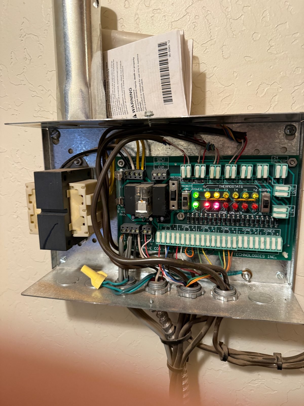 Radiant heating zone control board wiring inspected by Bear Hug Plumbing in Flagstaff, AZ